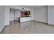 Bright, open living room flows into a kitchen featuring granite countertops and modern wood cabinets at 322 Karen Ave # 1106, Las Vegas, NV 89109