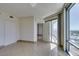 Bright living room featuring tile flooring, neutral walls and a balcony with beautiful city views at 322 Karen Ave # 1106, Las Vegas, NV 89109