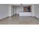 Bright, open living room flows into a kitchen featuring granite countertops and modern wood cabinets at 322 Karen Ave # 1106, Las Vegas, NV 89109