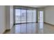 Bright, open living room with a large sliding glass door leading to a balcony with city views at 322 Karen Ave # 1106, Las Vegas, NV 89109
