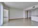 Spacious living room flowing into hallway and kitchen, illuminated by recessed ceiling lights at 322 Karen Ave # 1106, Las Vegas, NV 89109