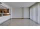 Living room with tile flooring, neutral walls, and access to the kitchen and balcony at 322 Karen Ave # 1106, Las Vegas, NV 89109