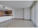 Living room featuring tile flooring, modern finishes, and natural light from the balcony at 322 Karen Ave # 1106, Las Vegas, NV 89109