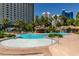 Stunning pool and water features in a desert oasis with surrounding lounge area at 322 Karen Ave # 1106, Las Vegas, NV 89109
