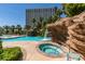 Unique pool area with water features including waterfalls and a jacuzzi at 322 Karen Ave # 1106, Las Vegas, NV 89109