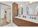 Bathroom boasts double vanity, stylish mirrors and cabinets, creating a functional and aesthetic space at 3220 Calle De El Cortez, Las Vegas, NV 89102