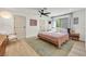 Cozy bedroom with a ceiling fan, a patterned rug, a comfortable bed, and natural light at 3220 Calle De El Cortez, Las Vegas, NV 89102