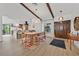 Bright and airy dining room featuring wood floors, exposed beams, modern lighting, and dining table at 3220 Calle De El Cortez, Las Vegas, NV 89102