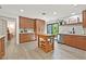 Modern kitchen with wood cabinets, stainless steel appliances, wood floors and natural light at 3220 Calle De El Cortez, Las Vegas, NV 89102