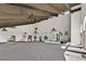 Expansive living room featuring high ceilings with wood beams and decorative chandeliers at 3220 Calle De El Cortez, Las Vegas, NV 89102