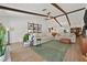 Bright living room with wood beam ceiling, hardwood floors, comfortable sofas, and modern lighting at 3220 Calle De El Cortez, Las Vegas, NV 89102