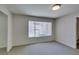 Comfortable bedroom with natural light, closet, and soft carpeting at 350 S Durango Dr # 103, Las Vegas, NV 89145