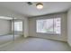 Spacious bedroom with large window, closet, and neutral décor, perfect for relaxation at 350 S Durango Dr # 103, Las Vegas, NV 89145