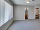 Bright bedroom with plush carpet, and ensuite bath access, offering a private retreat at 350 S Durango Dr # 103, Las Vegas, NV 89145