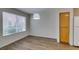 Dining area featuring wood-look floors, ample natural light, and convenient access to kitchen at 350 S Durango Dr # 103, Las Vegas, NV 89145