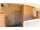 Close-up of condo entrance with secure door and unit number 103 at 350 S Durango Dr # 103, Las Vegas, NV 89145
