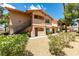View of the condo showcasing its architecture and well-maintained landscaping at 350 S Durango Dr # 103, Las Vegas, NV 89145