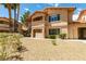 Attractive condo exterior features a balcony and lush greenery at 350 S Durango Dr # 103, Las Vegas, NV 89145