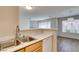 Bright kitchen view with stainless steel sink and view into open-concept living spaces at 350 S Durango Dr # 103, Las Vegas, NV 89145