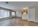 Open-concept living room with modern lighting and connecting kitchen area at 350 S Durango Dr # 103, Las Vegas, NV 89145