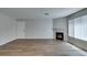 Spacious living room with fireplace, hardwood floors and natural light at 350 S Durango Dr # 103, Las Vegas, NV 89145