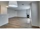 Bright living room featuring wood-look floors, a fireplace, and an open layout at 350 S Durango Dr # 103, Las Vegas, NV 89145