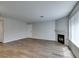 Open living area showcasing fireplace, hardwood floors and a neutral color scheme at 350 S Durango Dr # 103, Las Vegas, NV 89145