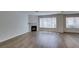 Cozy living room featuring a fireplace, hardwood floors, and ample natural light at 350 S Durango Dr # 103, Las Vegas, NV 89145