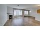 Bright living room with hardwood floors, fireplace, and large windows at 350 S Durango Dr # 103, Las Vegas, NV 89145