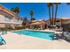 Inviting community pool with lounge chairs and shade, perfect for relaxing on sunny days at 350 S Durango Dr # 103, Las Vegas, NV 89145