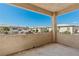 Spacious balcony overlooking neighboring residential properties and a blue sky at 3608 Quetonia St # 204, Las Vegas, NV 89108