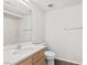 Bright bathroom with a single vanity, sink and shower and wood-like flooring at 3608 Quetonia St # 204, Las Vegas, NV 89108