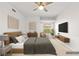 Cozy staged bedroom with a neutral color palette and contemporary decor at 3608 Quetonia St # 204, Las Vegas, NV 89108