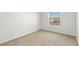Neutral bedroom with carpet flooring and bright natural light through the window at 3608 Quetonia St # 204, Las Vegas, NV 89108