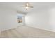 A bedroom with carpeted floors, a ceiling fan, and a window offering natural light at 3608 Quetonia St # 204, Las Vegas, NV 89108