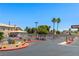 Well-maintained entrance to the community, accentuated by palm trees and meticulous desert landscaping at 3608 Quetonia St # 204, Las Vegas, NV 89108