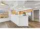 Spacious kitchen with modern appliances, wooden cabinets, and counter seating area at 3608 Quetonia St # 204, Las Vegas, NV 89108