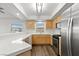 Bright kitchen with stainless steel appliances, light wood cabinets and white countertops at 3608 Quetonia St # 204, Las Vegas, NV 89108