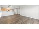 Open floor plan view of the living room that flows into the kitchen with modern appliances at 3608 Quetonia St # 204, Las Vegas, NV 89108