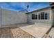 Outdoor patio with concrete flooring, a privacy wall, and a small rock garden area at 3924 Blackford Pl, Las Vegas, NV 89102