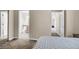 View of the bedroom leading to the bathroom with a framed mirror door at 4050 Pacific Harbors Dr # 224, Las Vegas, NV 89121