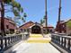 Beautiful entryway to the community clubhouse with unique stone design, manicured landscaping and inviting entrance at 4050 Pacific Harbors Dr # 224, Las Vegas, NV 89121