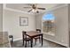 Dining room area with contemporary table, plush carpeting, and an elegant window letting in natural light at 4050 Pacific Harbors Dr # 224, Las Vegas, NV 89121
