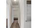 Hallway with laundry closet featuring stacked washer and dryer leading into bedroom at 4050 Pacific Harbors Dr # 224, Las Vegas, NV 89121