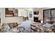 Living room featuring a decorative fireplace, plush floral seating, and slider to exterior at 4050 Pacific Harbors Dr # 224, Las Vegas, NV 89121