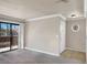 Cozy living room with sliding glass doors to the outside balcony and decorative round window at 4050 Pacific Harbors Dr # 224, Las Vegas, NV 89121