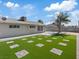 Well-maintained backyard featuring a neatly manicured lawn with brick accents, offering space for relaxation and recreation at 4204 El Jardin Ave, Las Vegas, NV 89102