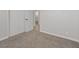 Bedroom showcasing carpet flooring, a neutral color palette, and closet doors at 4204 El Jardin Ave, Las Vegas, NV 89102