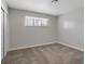Bedroom with neutral color palette, carpet flooring, and a bright window at 4204 El Jardin Ave, Las Vegas, NV 89102