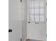 White front door with glass detailing leading to the interior of the home at 4204 El Jardin Ave, Las Vegas, NV 89102